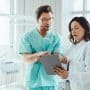 Two orthodontists work together. Compare orthodontic practice ownership structures, from independent practice to OSOs and DSOs, and what each means for your equity.